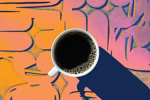 A cup of coffee on a colorful background